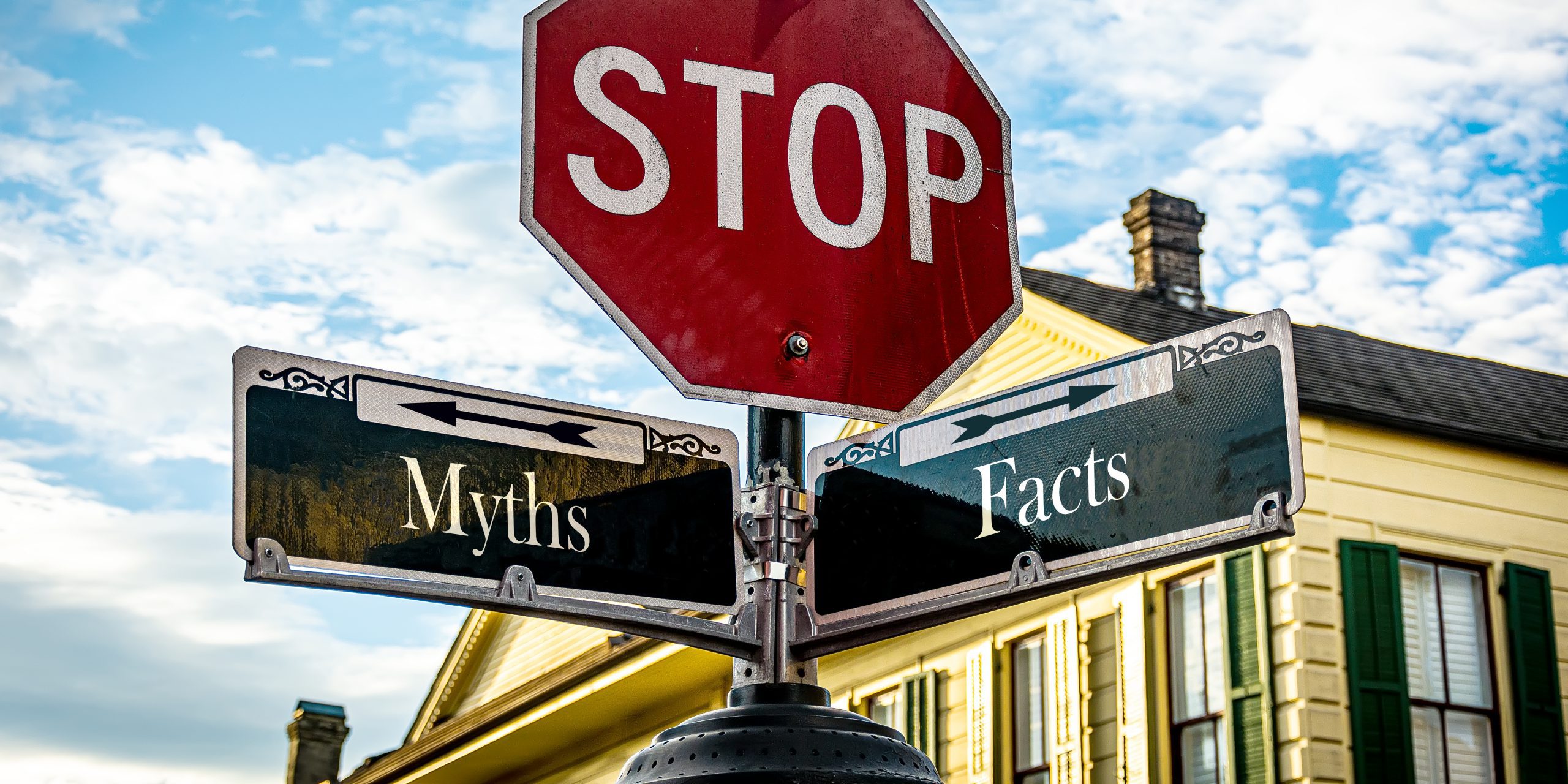 closeup of stop sign at the intersection of myths and facts