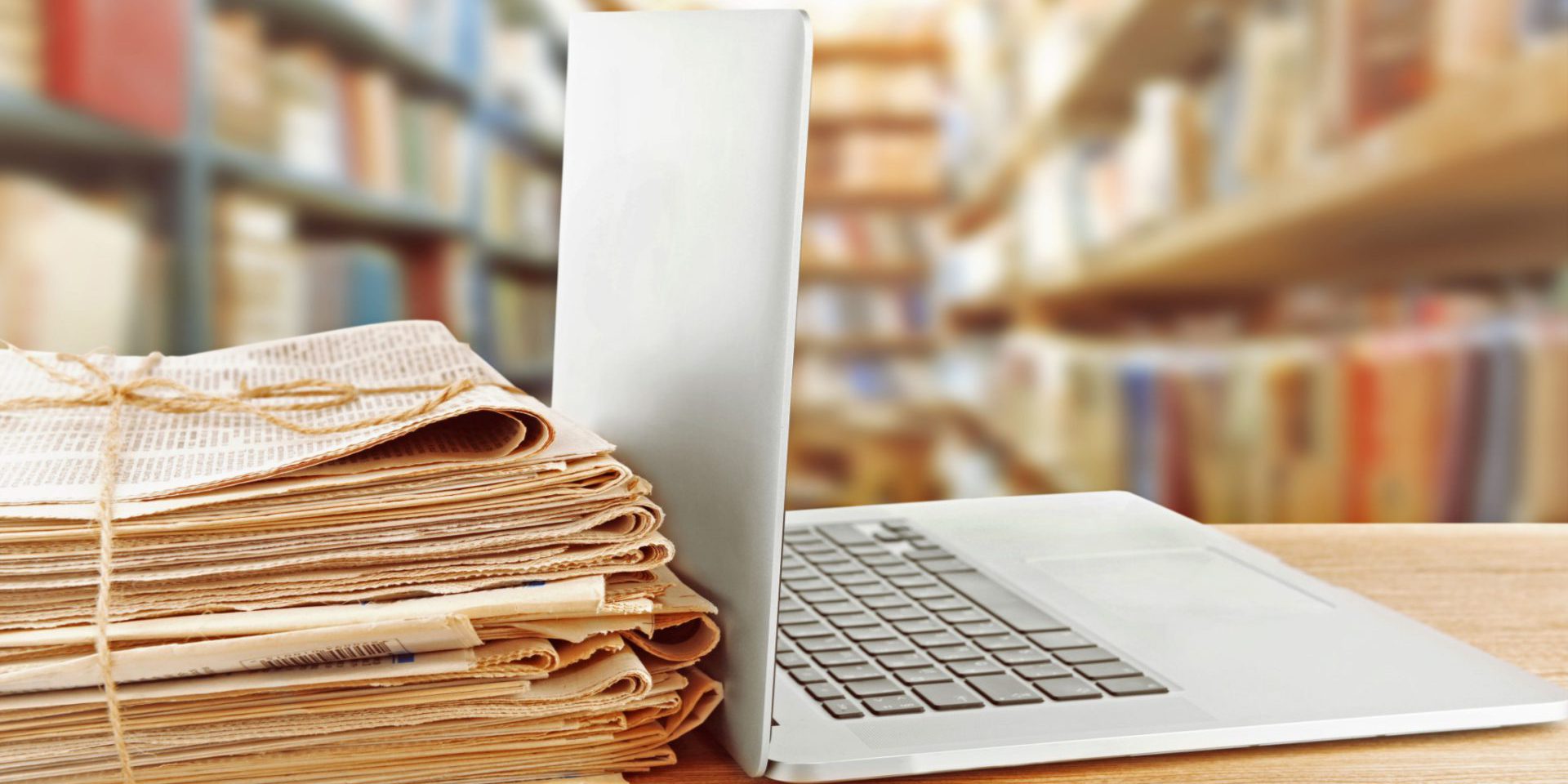 Laptop with documents on desk. RIM Program.