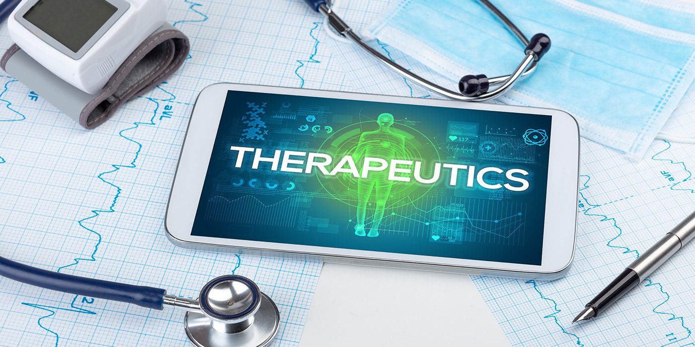 Therapeutics graphic on phone screen on top of medical records
