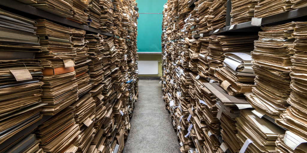 isle between two shelves stacked with cardboard